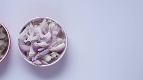 Top View of Slice of Onion and Paste in a Bowl on White Background