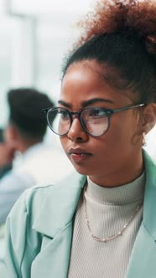 Professional Woman Listens Attentively in Corporate Setting