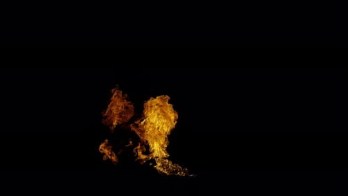 Ignite Collection: Large flames blown sideways from a burning base on a dark background shot in 4k a