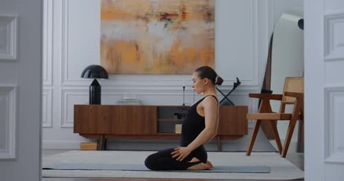 Woman Kneeling and Stretching on Yoga Mat