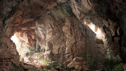 A Cave Filled with Lots of Rocks and Water