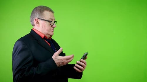 Adult Man in Suit Speaking on Cellphone