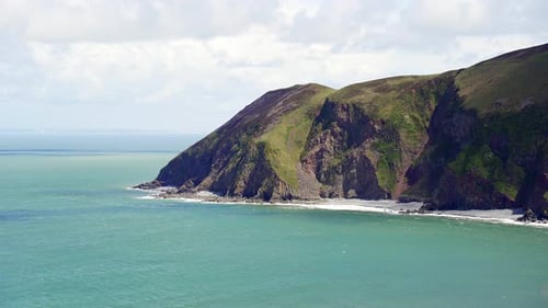 View of the rocky cliffs and headland at the end of Lynmouth Bay from Lynton, Devon, England, UK