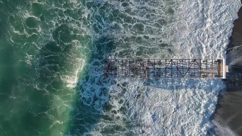 Old Dismantled Pier Aerial View in Slow Motion Strong Storm on the Coast Big Waves in Slow Motion