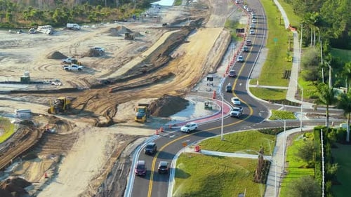 Aerial View of Busy American Highway Road Under Construction Development of Roundabout Traffic