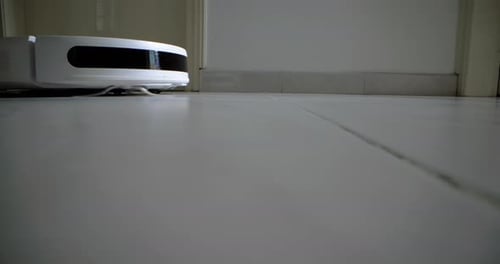Robotic Vacuum Cleaner Cleaning Tile Floor