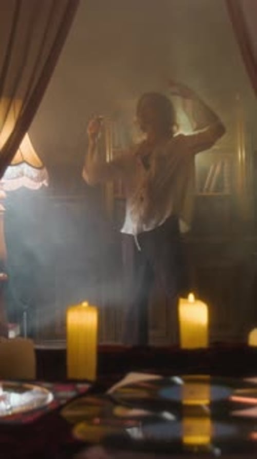 Vampire Woman Dancing in Room Obscured by Haze