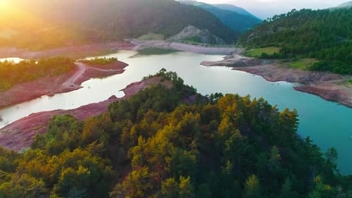 Aerial View of Forest and Lake at Sunset