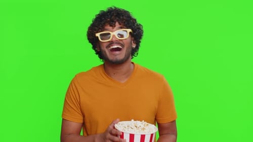 Enthusiastic Man Eating Popcorn on Green Screen