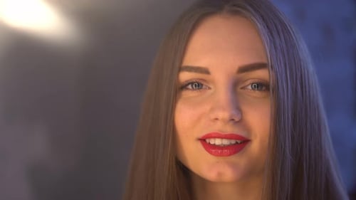 Beautiful Woman Pouting Lips and Smiling Close Up