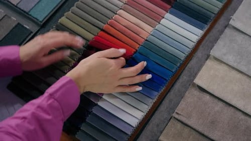 Top View Female Hands Arms Touch Soft Velvet Cloth Samples Eco Natural Materials in Shop Woman