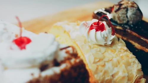 Various Cake Slices on a Wood Table