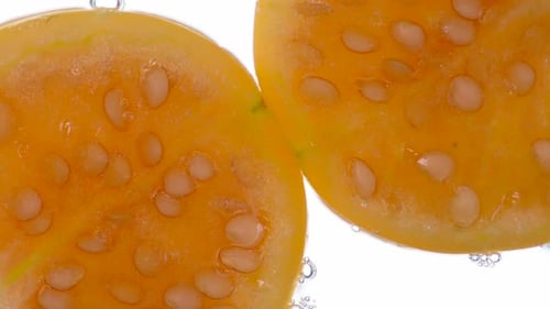 Close-Up of Sliced Yellow Fruit with Seeds