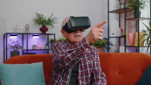 Senior Man Enjoys Virtual Reality Headset at Home