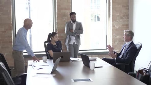 Business People Meeting in Conference Room with Laptops