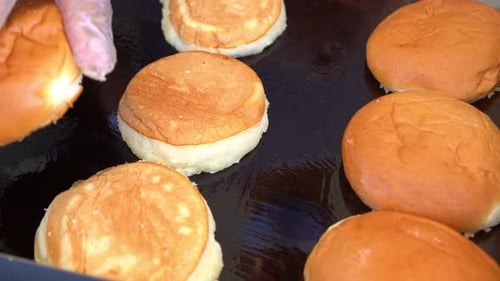 Roasting the buns on the grill - top view