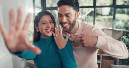 Selfie, engagement ring and love with couple in new home for celebration