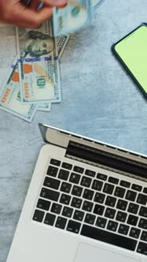 Close up of female hands count money cash at office work desk. Vertical video
