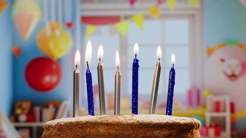 Woman Kid Child Blowing Candles on Birthday Cake Macro Close Up of Some Unlit Candles and Just One