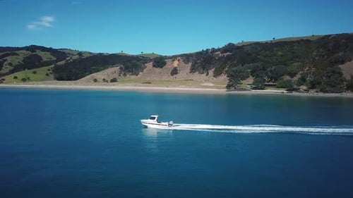 Aerial drone 4k cinematic footage. Flying above speed boat on the blue sea. sideways following fast