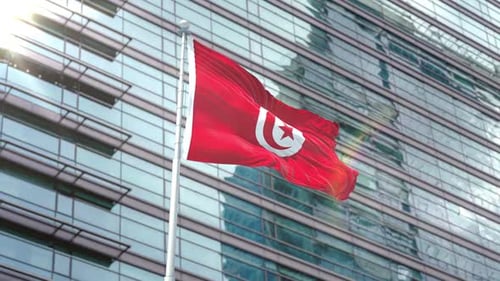 Realistic Waving Tunisian Flag Against Modern Building