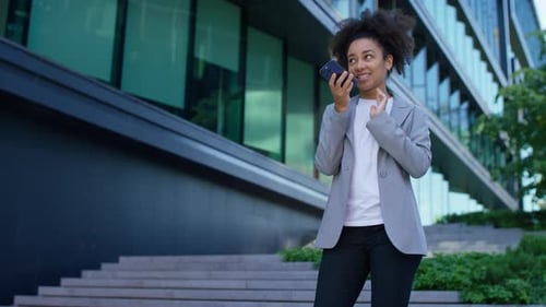 Business Woman Talking on Phone Outside Office Building