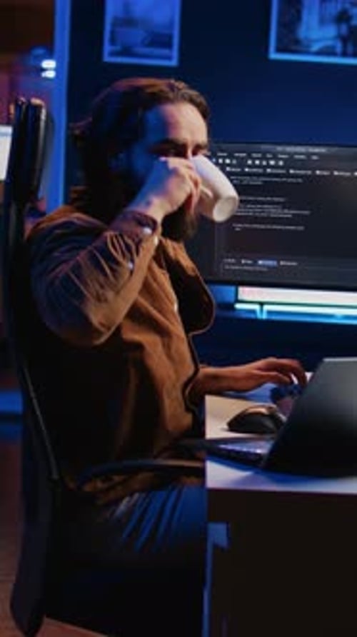 IT Expert Doing Multitasking in Home Office Listening Music Drinking Coffee