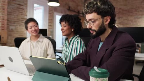 Diverse Team Collaborates in Modern Office