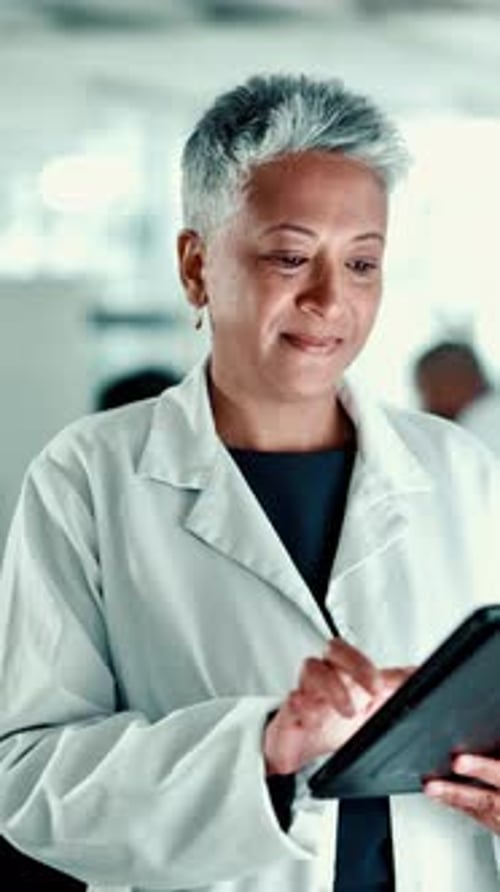 Mature, study or woman in laboratory with tablet, science or gene editing medical experiment