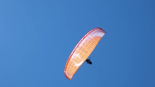 Tourist Parasailing in Clear Sky in Summer