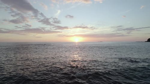 Drone view dramatic sunset sky over the beach Water island. sea stock motion.