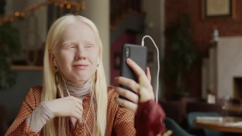 Gen Z Girl With Albinism Chatting On Video Call