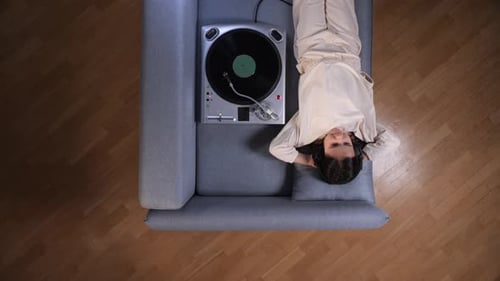 Girl Listening to Vinyl on Couch, Birds Eye