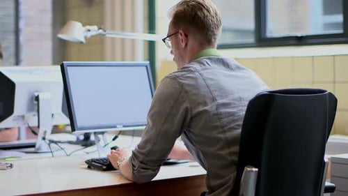 Businessman using computer in office