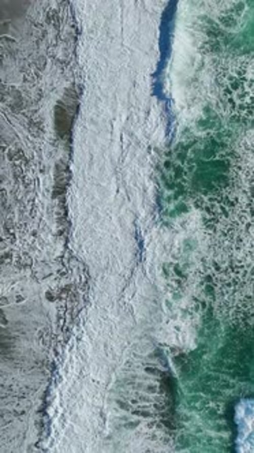 Vertical Video Powerful Azure Storm Over the Ocean With Dramatic Waves and Moody Sky