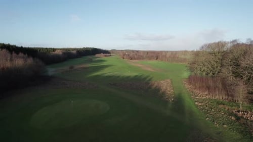 Aerial View Of Golf Fairway And Green, Luxury Golf Course - Boom Out Shot
