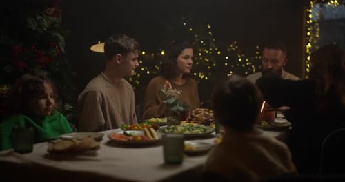 Family enjoying holiday meal together in cozy setting