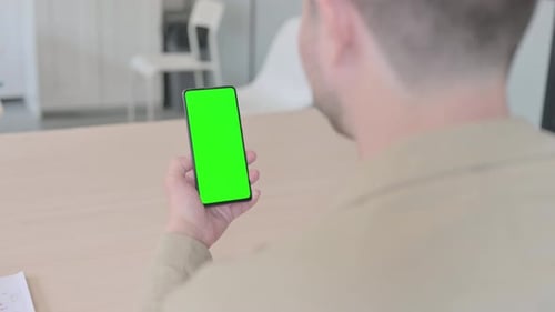 Close Up of Man Using Phone with Green Screen