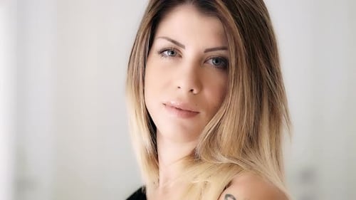 Attractive Woman Posing with Long, Styled Hair