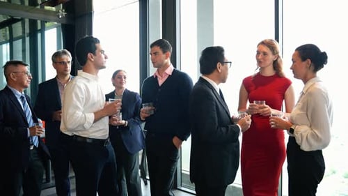 Business Professionals Conversing at Corporate Event in City
