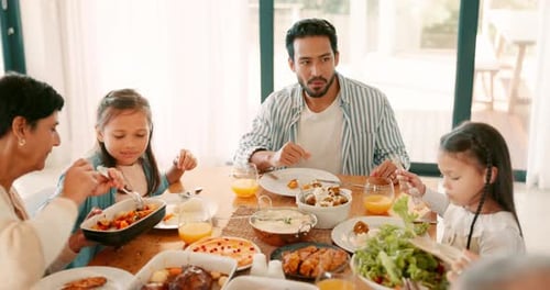 Family Share Meal Around Dining Table Together