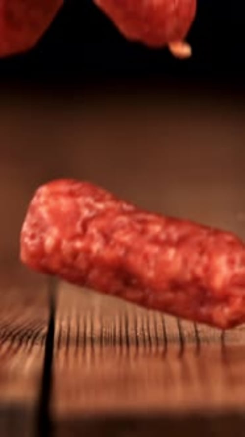 Mini Salami Fall on a Wooden Table Filmed on a Highspeed Camera at 1000 Fps