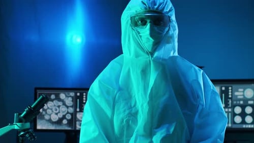 Researcher in Protective Suit in a Blue Laboratory