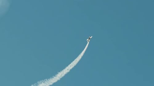 Stunt Plane with White Smoke Trail