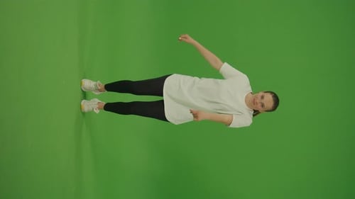 Vertical Video Female Dancer Performing a Dance on Green Screen Street Dancing