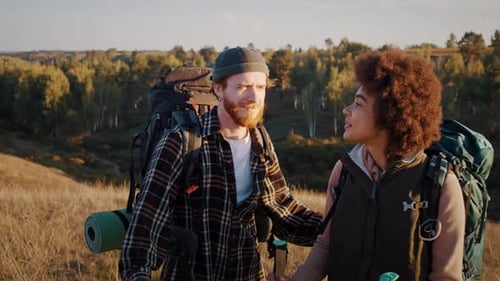 Happy Mixed Race Family with Backpacks Talks in Sunset Valley