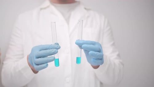 Close Up of Lab Worker Holding Test Tubes