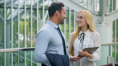 Happy Businessman Meeting with Businesswoman in Modern Office Terrace Watching Digital Tablet and Ta