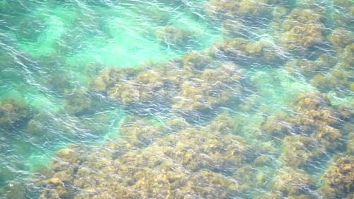 Aerial View on Calm Azure Sea and Volcanic Rocky Shores Small Waves on Water Surface Nature Summer