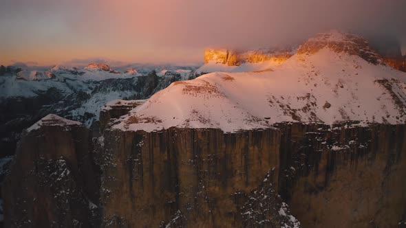 Drone flies up the snowy ridgeline of Sella in the Dolomites., Holidays ...